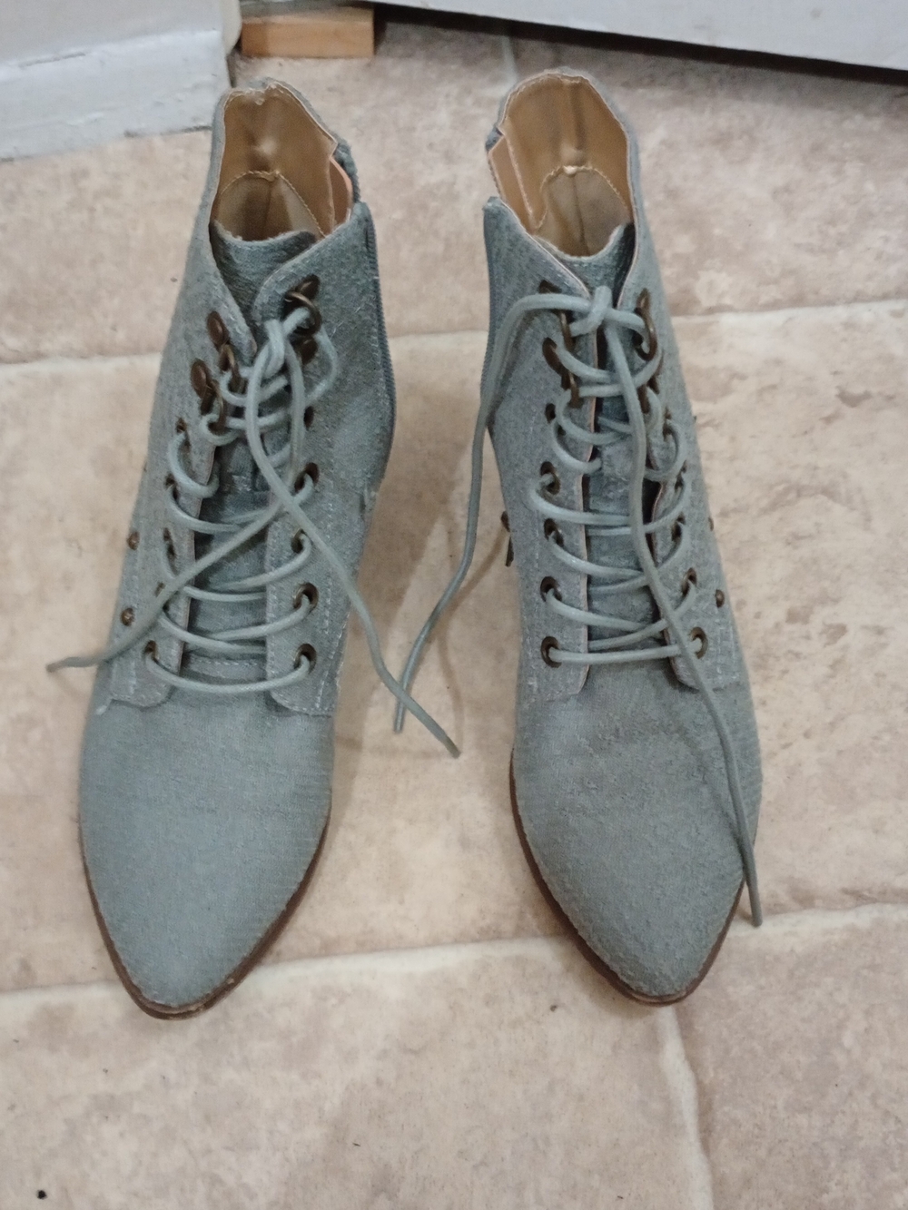 Joyfolie light blue suede ankle boots in gold eyelets, lace-up fronts, and side
